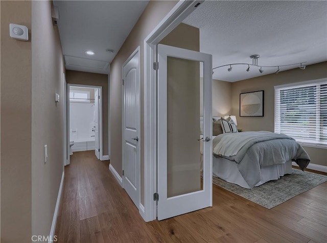 22182 Platino, Mission Viejo, CA 92691 - corridor with wood finished floors, healthy amount of natural light, and recessed lighting