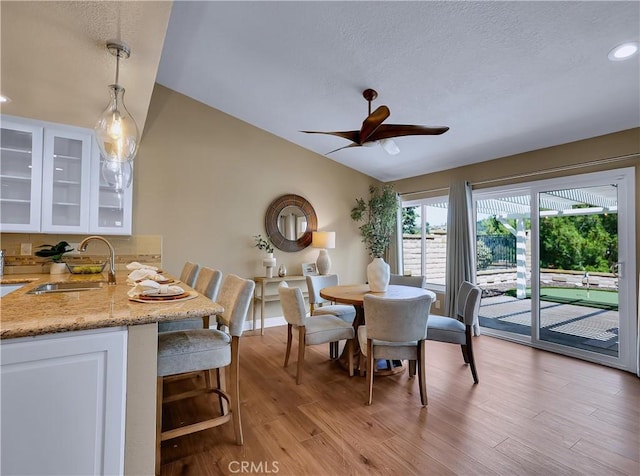 22182 Platino, Mission Viejo, CA 92691 - dining space with ceiling fan, light wood finished floors, lofted ceiling, recessed lighting, and a textured ceiling