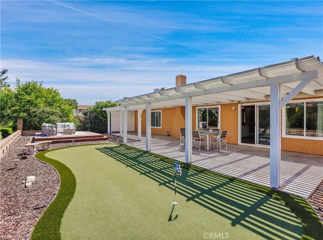22182 Platino, Mission Viejo, CA 92691 - rear view of property with a putting green, a pergola, a patio area, and stucco siding