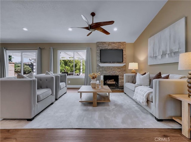 22182 Platino, Mission Viejo, CA 92691 - living room featuring a ceiling fan, a fireplace, wood finished floors, recessed lighting, and vaulted ceiling