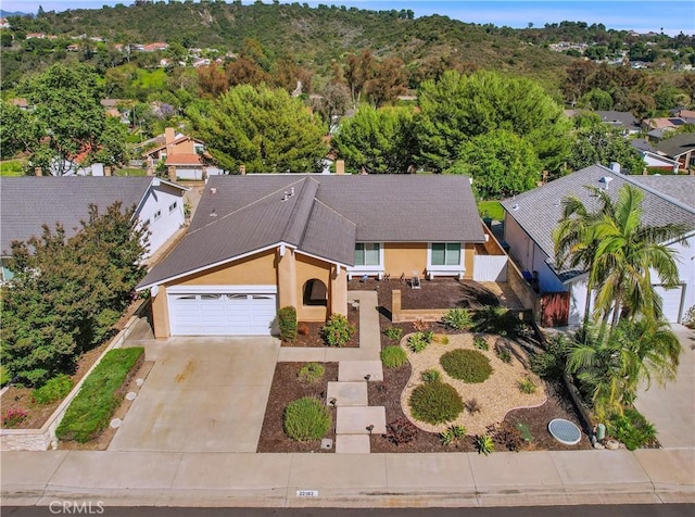 22182 Platino, Mission Viejo, CA 92691 - view of front of property featuring stucco siding, an attached garage, concrete driveway, and a shingled roof