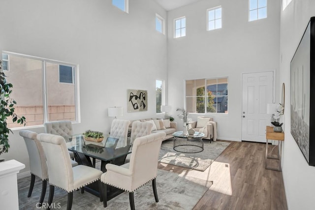 24186 Matthew Pl, Newhall, CA 91321 - dining area with a high ceiling and wood finished floors