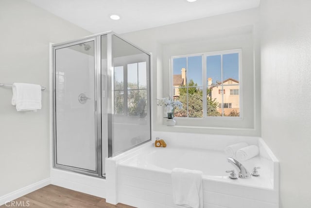 24186 Matthew Pl, Newhall, CA 91321 - bathroom with a shower stall, a bath, and wood finished floors