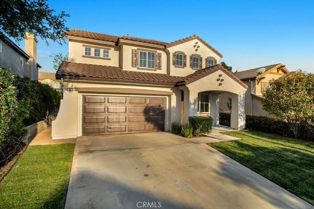24186 Matthew Pl, Newhall, CA 91321 - mediterranean / spanish-style house featuring an attached garage, stucco siding, driveway, a front yard, and a tile roof