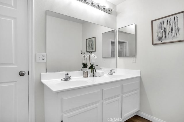 24186 Matthew Pl, Newhall, CA 91321 - bathroom featuring double vanity and baseboards
