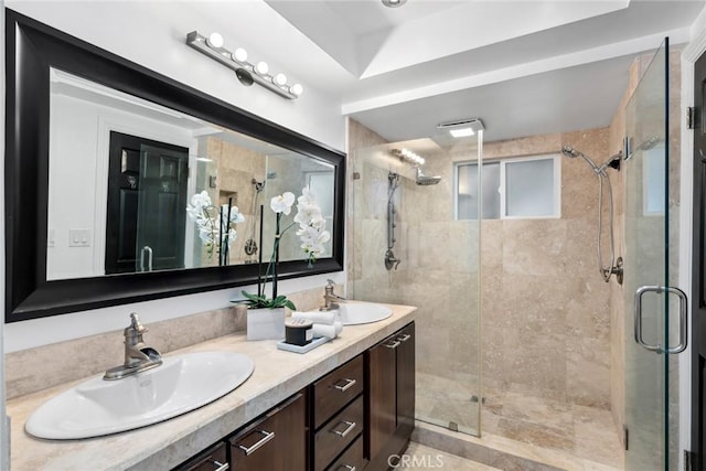 10255 Overhill Dr, Santa Ana, CA 92705 - full bathroom with a stall shower, double vanity, and a tray ceiling