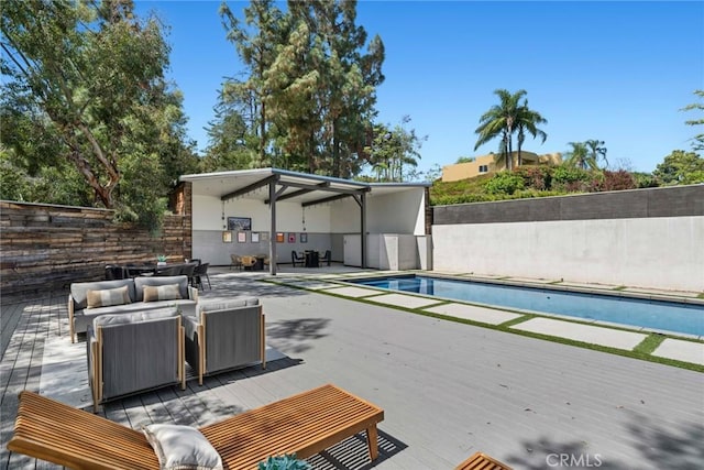 10255 Overhill Dr, Santa Ana, CA 92705 - view of swimming pool with an outdoor living space, a wooden deck, and a fenced backyard
