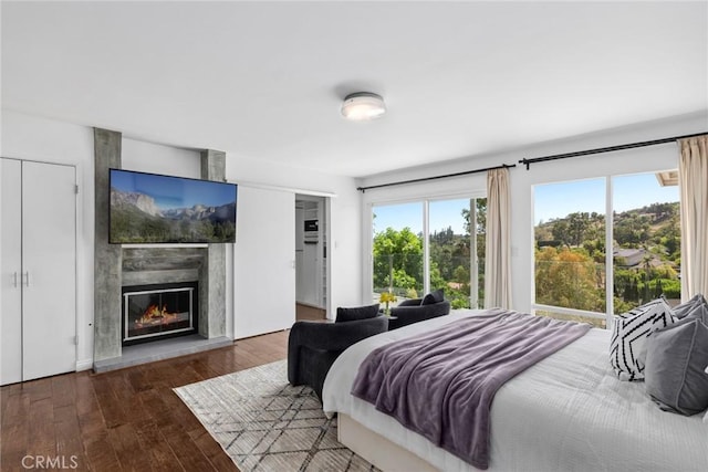 10255 Overhill Dr, Santa Ana, CA 92705 - bedroom featuring wood finished floors and a fireplace