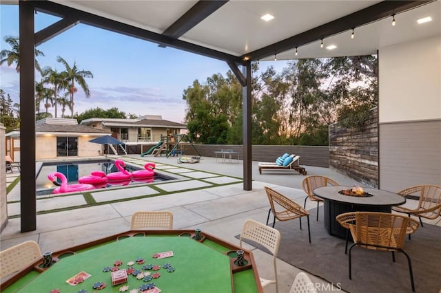 10255 Overhill Dr, Santa Ana, CA 92705 - view of patio / terrace with a fire pit and a playground