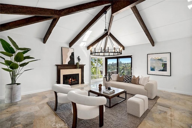 10255 Overhill Dr, Santa Ana, CA 92705 - living area featuring beam ceiling, a glass covered fireplace, a chandelier, light stone finish flooring, and high vaulted ceiling