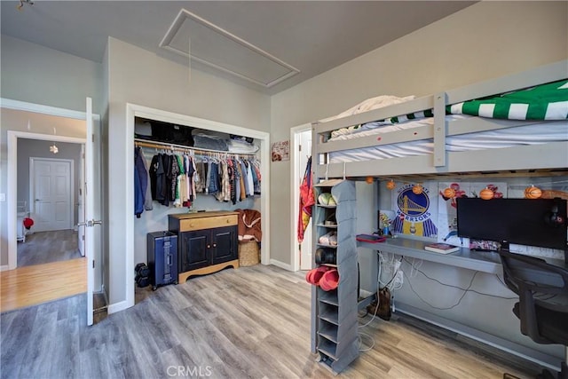 2166 Lopez Dr, Arroyo Grande, CA 93420 - bedroom featuring attic access, wood finished floors, a closet, and a desk