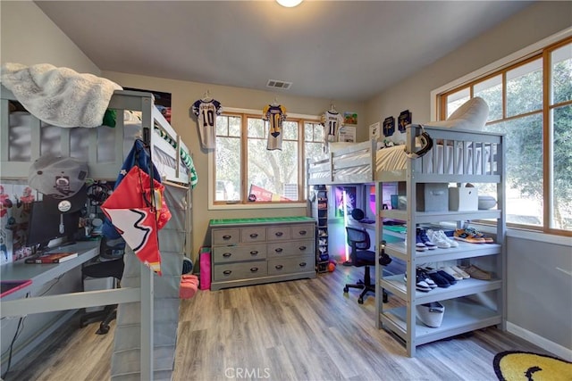 2166 Lopez Dr, Arroyo Grande, CA 93420 - bedroom featuring wood finished floors, multiple windows, and a desk