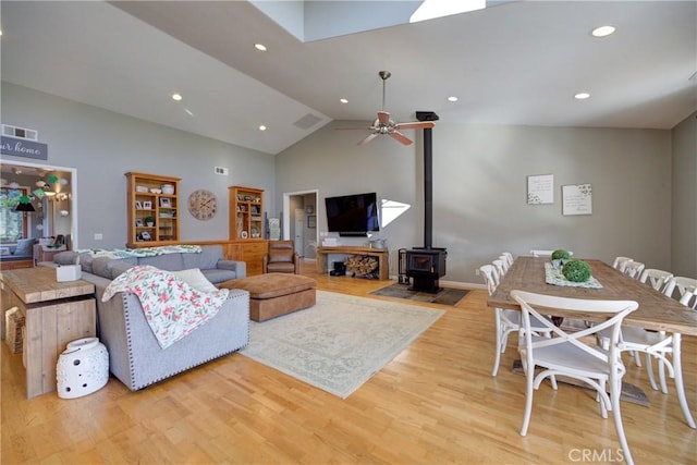 2166 Lopez Dr, Arroyo Grande, CA 93420 - living area with light wood-style flooring, a wood stove, recessed lighting, a ceiling fan, and high vaulted ceiling