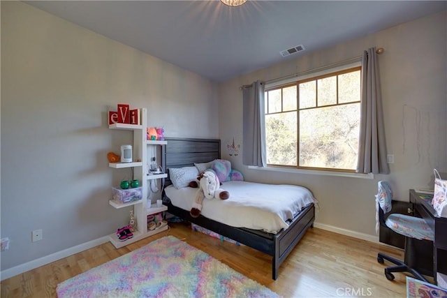 2166 Lopez Dr, Arroyo Grande, CA 93420 - bedroom with multiple windows and wood finished floors