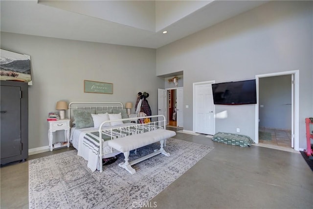 2166 Lopez Dr, Arroyo Grande, CA 93420 - bedroom featuring a towering ceiling, concrete flooring, and recessed lighting