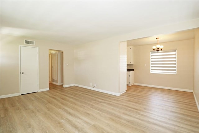 1116 N Center St, Orange, CA 92867 - unfurnished room with a chandelier and light wood-style flooring