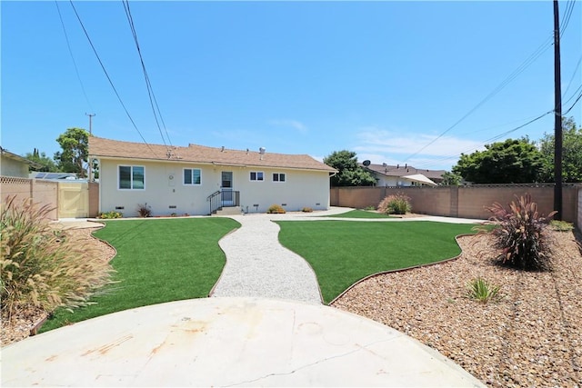 1116 N Center St, Orange, CA 92867 - rear view of house with a fenced backyard, stucco siding, and a patio