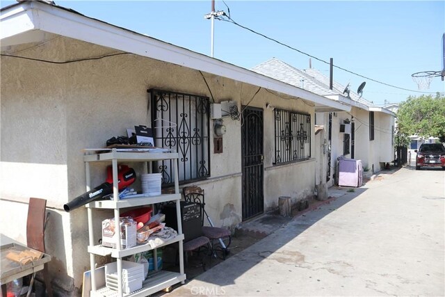 164 N Townsend Ave, City Terrace, CA 90063 - view of front of property featuring stucco siding and a shingled roof