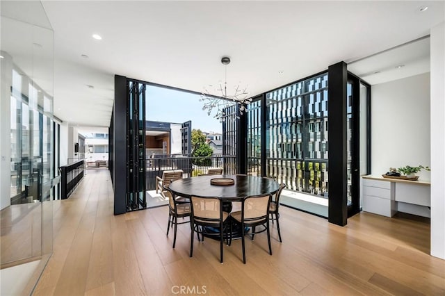 2821 Alma Ave, Manhattan Beach, CA 90266 - dining space featuring a chandelier, light wood finished floors, and expansive windows