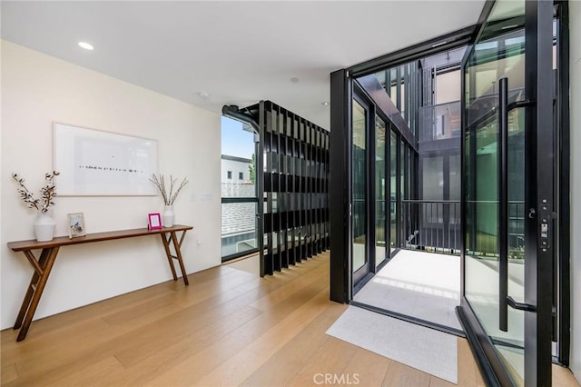2821 Alma Ave, Manhattan Beach, CA 90266 - doorway to outside with wood finished floors, floor to ceiling windows, and recessed lighting