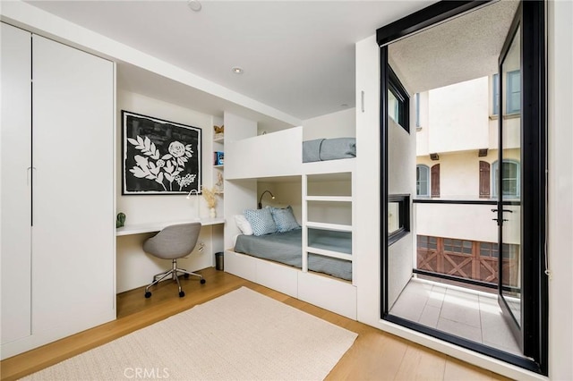 2821 Alma Ave, Manhattan Beach, CA 90266 - bedroom with wood finished floors and built in study area