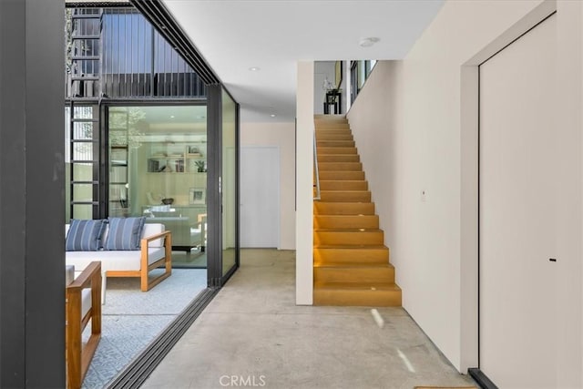 2821 Alma Ave, Manhattan Beach, CA 90266 - hallway with stairway, floor to ceiling windows, and concrete floors