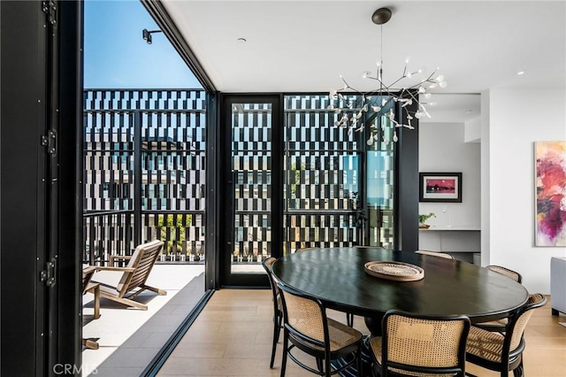 2821 Alma Ave, Manhattan Beach, CA 90266 - dining space featuring a chandelier, expansive windows, and wood finished floors