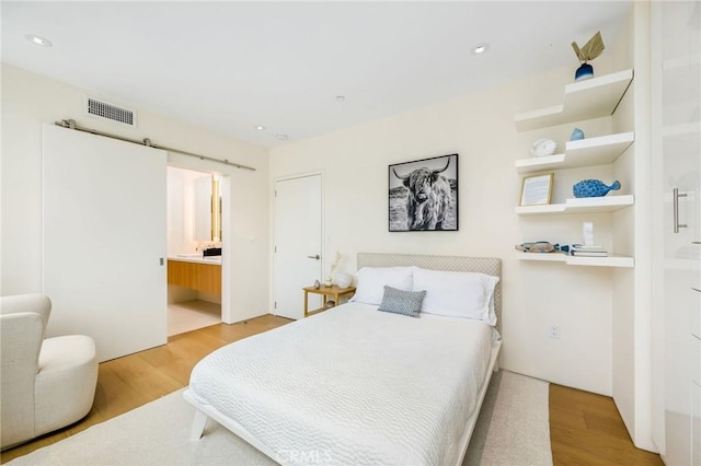 2821 Alma Ave, Manhattan Beach, CA 90266 - bedroom featuring wood finished floors, recessed lighting, and ensuite bathroom