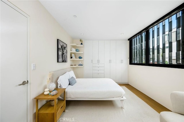 2821 Alma Ave, Manhattan Beach, CA 90266 - bedroom with multiple windows and wood finished floors