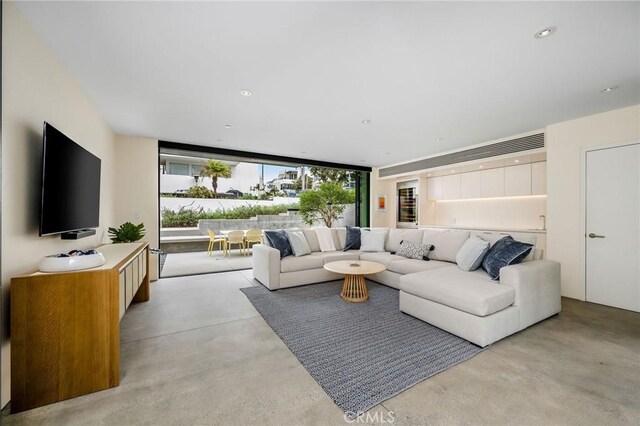 2821 Alma Ave, Manhattan Beach, CA 90266 - living area with concrete floors, expansive windows, and recessed lighting