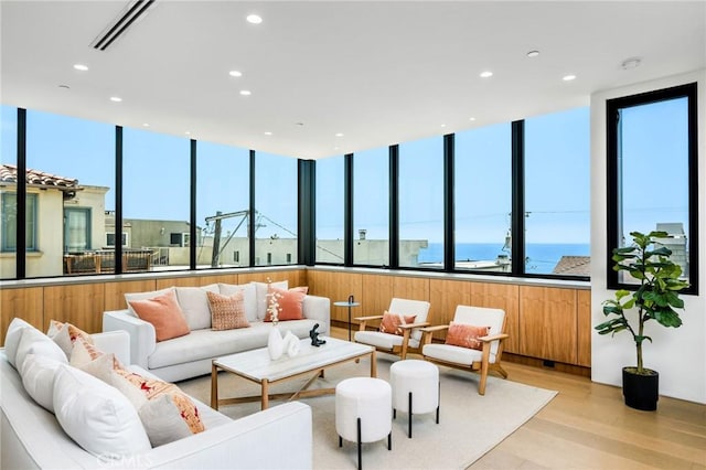2821 Alma Ave, Manhattan Beach, CA 90266 - living area with recessed lighting, light wood-style floors, a wall of windows, and a water view