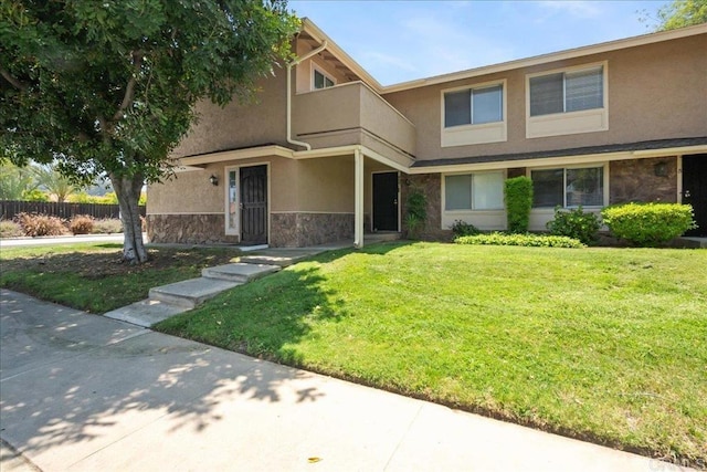955 Amistad Pl Unit C, El Cajon, CA 92019 - view of property with stone siding, stucco siding, and a balcony