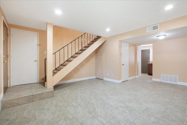 955 Amistad Pl Unit C, El Cajon, CA 92019 - unfurnished living room with stairway and recessed lighting