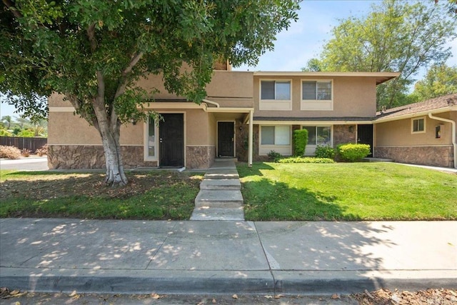 955 Amistad Pl Unit C, El Cajon, CA 92019 - view of front of property featuring stone siding, stucco siding, and a front lawn