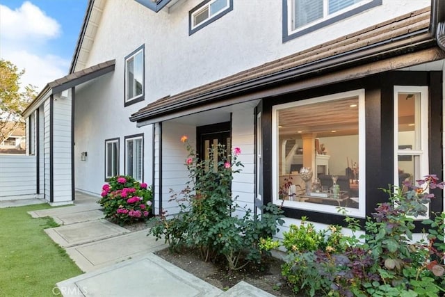 1174 Kingston St, Costa Mesa, CA 92626 - doorway to property with stucco siding