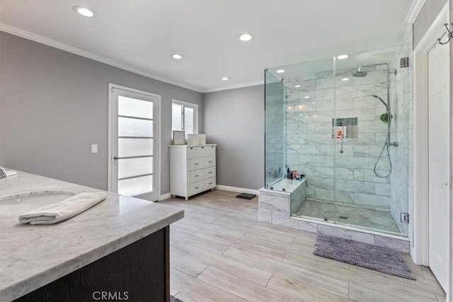 1174 Kingston St, Costa Mesa, CA 92626 - bathroom featuring ornamental molding, double vanity, recessed lighting, a shower stall, and wood finished floors