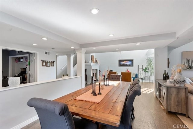 1174 Kingston St, Costa Mesa, CA 92626 - dining room featuring wood finished floors, recessed lighting, and ornate columns