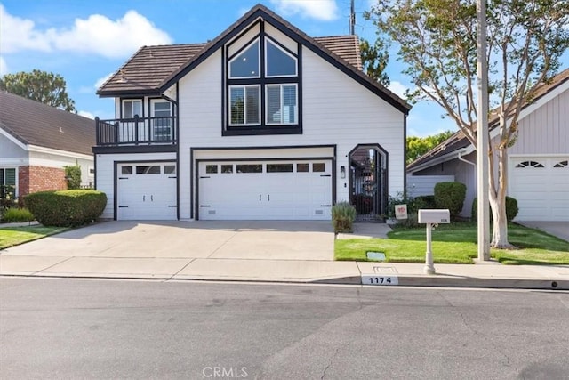 1174 Kingston St, Costa Mesa, CA 92626 - view of front of house with a garage and concrete driveway