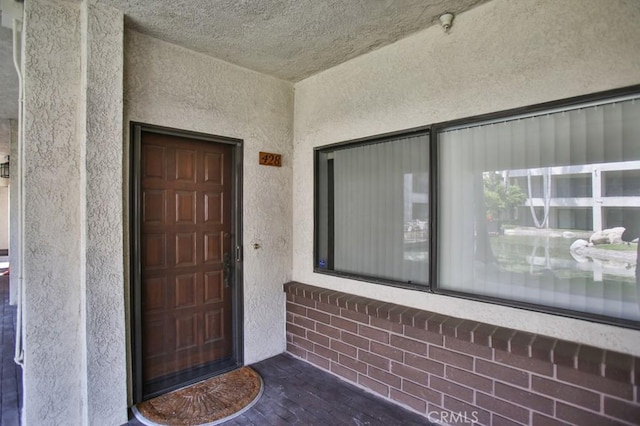 11600 Warner Ave Unit 428, Fountain Valley, CA 92708 - view of exterior entry featuring stucco siding