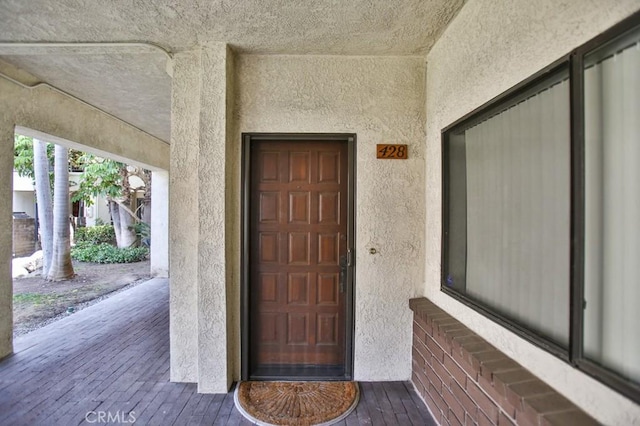 11600 Warner Ave Unit 428, Fountain Valley, CA 92708 - doorway to property featuring stucco siding