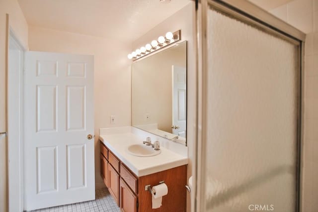 11600 Warner Ave Unit 428, Fountain Valley, CA 92708 - full bathroom featuring vanity, tile patterned floors, and a shower with door