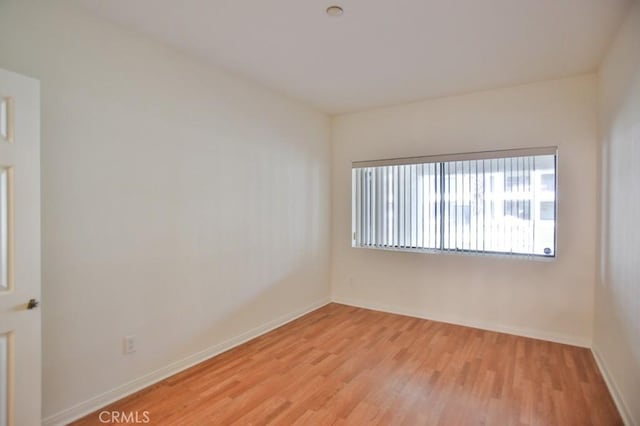 11600 Warner Ave Unit 428, Fountain Valley, CA 92708 - unfurnished room with light wood-style flooring and baseboards