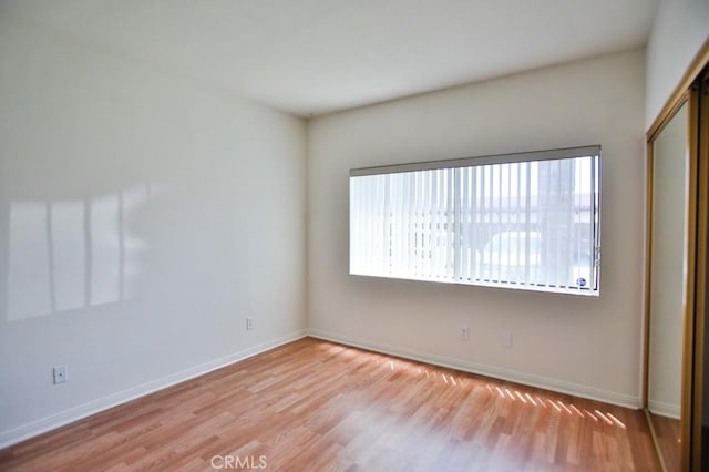 11600 Warner Ave Unit 428, Fountain Valley, CA 92708 - empty room with light wood finished floors and baseboards