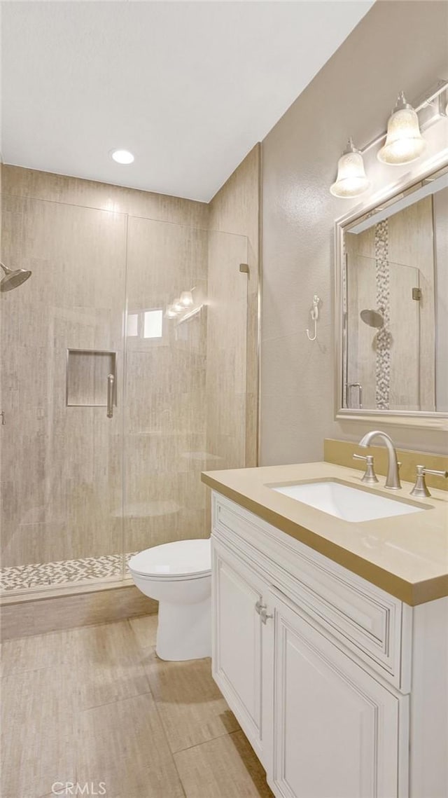24965 Seagate, Dana Point, CA 92629 - bathroom featuring vanity, a stall shower, wood finished floors, and recessed lighting