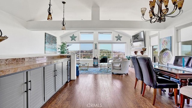 24965 Seagate, Dana Point, CA 92629 - dining room featuring lofted ceiling, a chandelier, and dark wood finished floors