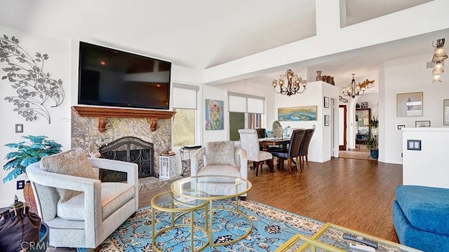 24965 Seagate, Dana Point, CA 92629 - living area featuring a chandelier, a fireplace, wood finished floors, and vaulted ceiling