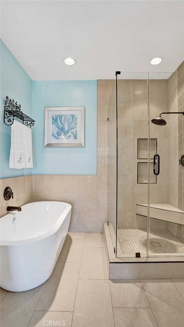 24965 Seagate, Dana Point, CA 92629 - bathroom with a freestanding tub, a shower stall, recessed lighting, tile walls, and tile patterned floors