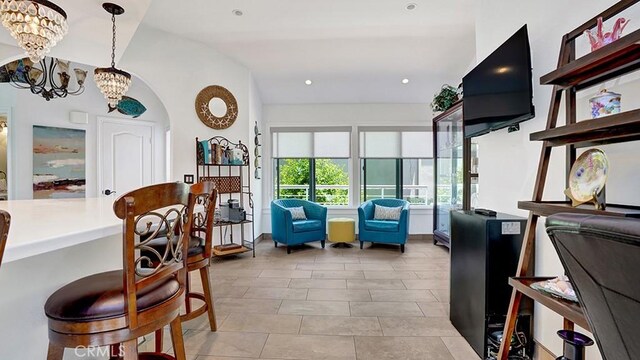 24965 Seagate, Dana Point, CA 92629 - dining area featuring arched walkways, a chandelier, light tile patterned floors, and recessed lighting