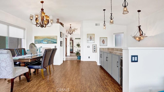 24965 Seagate, Dana Point, CA 92629 - dining space with a chandelier and dark wood-type flooring