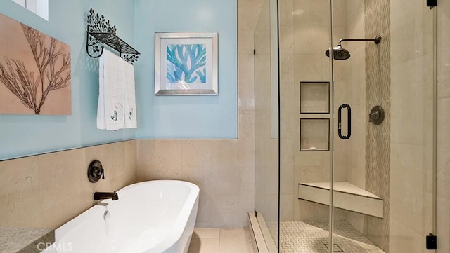 24965 Seagate, Dana Point, CA 92629 - full bathroom featuring a shower stall, a soaking tub, tile walls, and a wainscoted wall